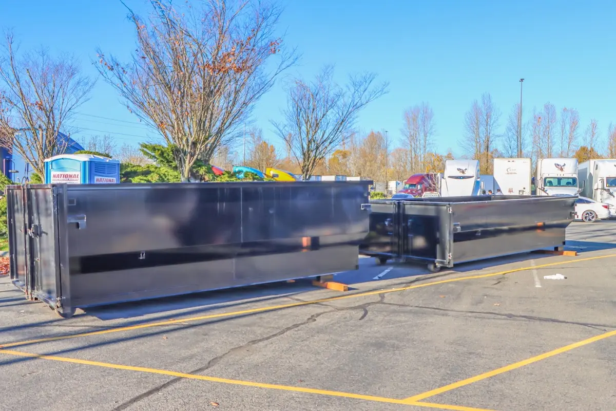 Professional dumpster rental service with roll-off container on residential driveway in Goleta